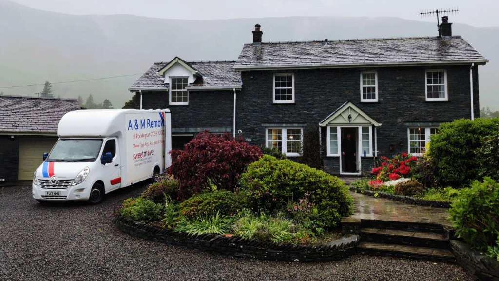 A&M Removals van at a residential property