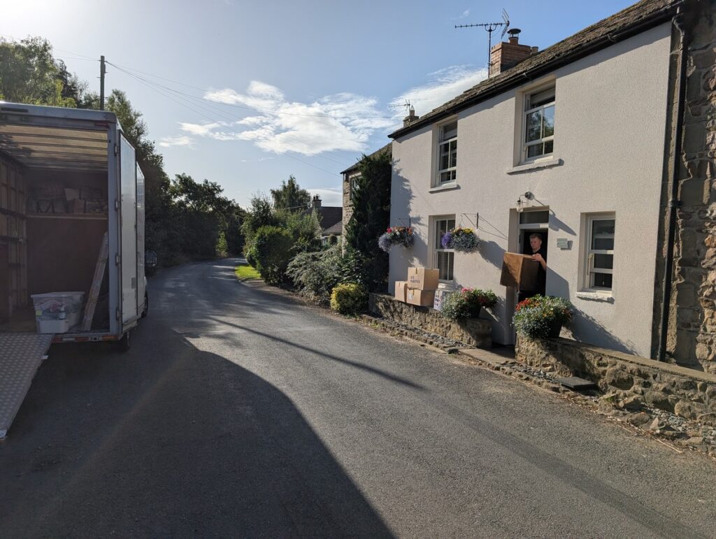am removals van parked outside a house